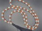 Preview: Handgefertigte Rudraksha & Quartz Mala aus Nepal mit feinen Metall-Spacern und schwarzer Quaste.